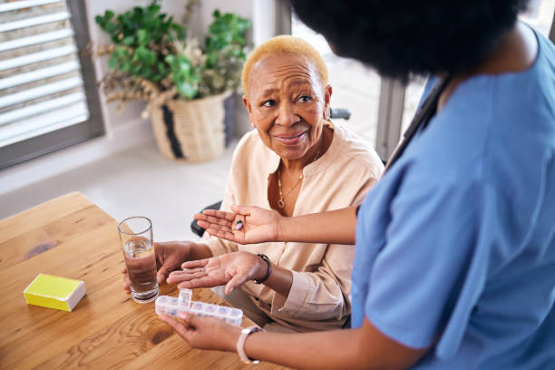 A caregiver helping with medication reminders