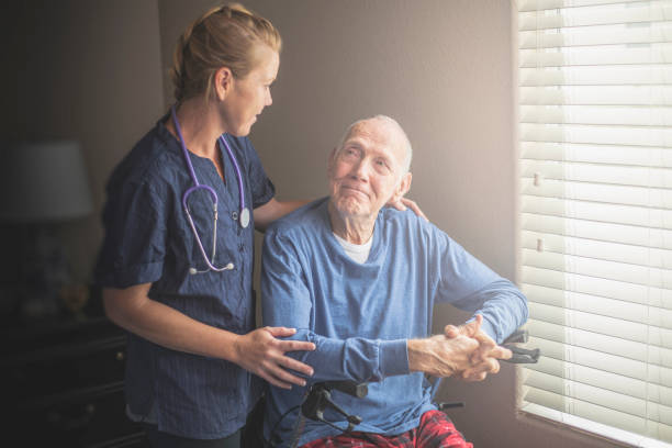A nurse comforting a palliative care patient