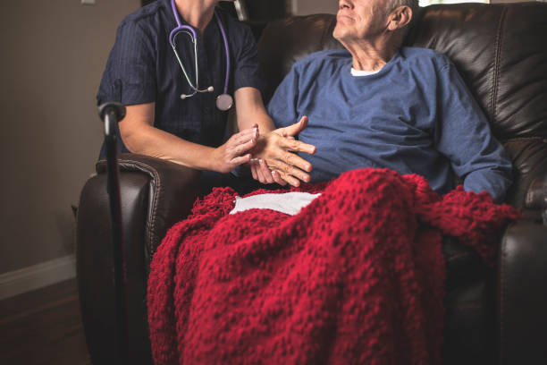 A nurse comforting a palliative care patient