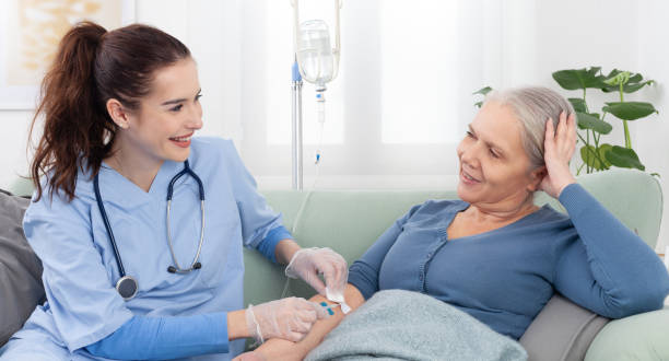 A nurse caring for a patient receiving infusion therapy
