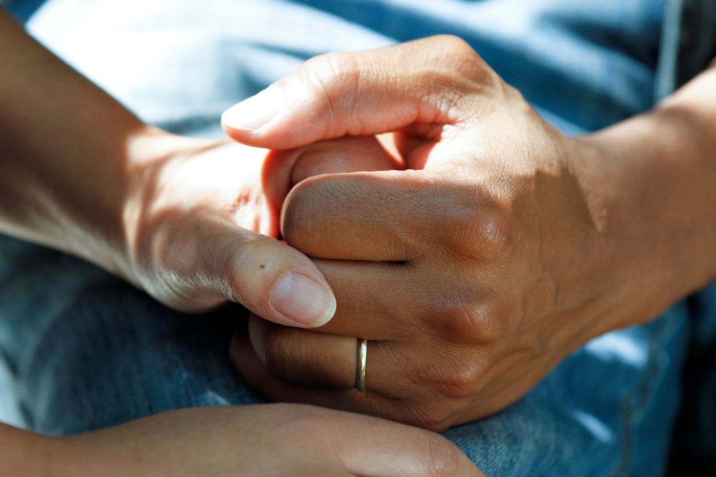 Comforting hands representing our mission of compassionate care